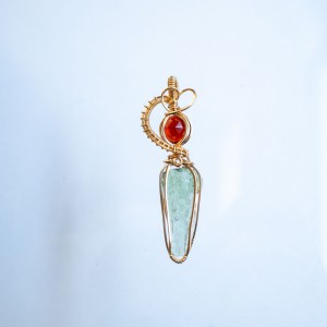 Moldavite with garnet pendant