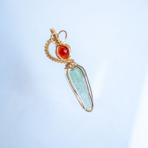 Moldavite with garnet pendant