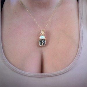 Moldavite with opal pendant