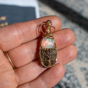 Moldavite with opal pendant