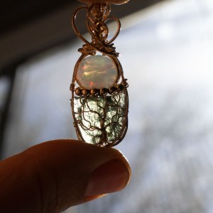 Moldavite with opal pendant