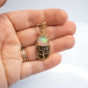 Moldavite with opal pendant