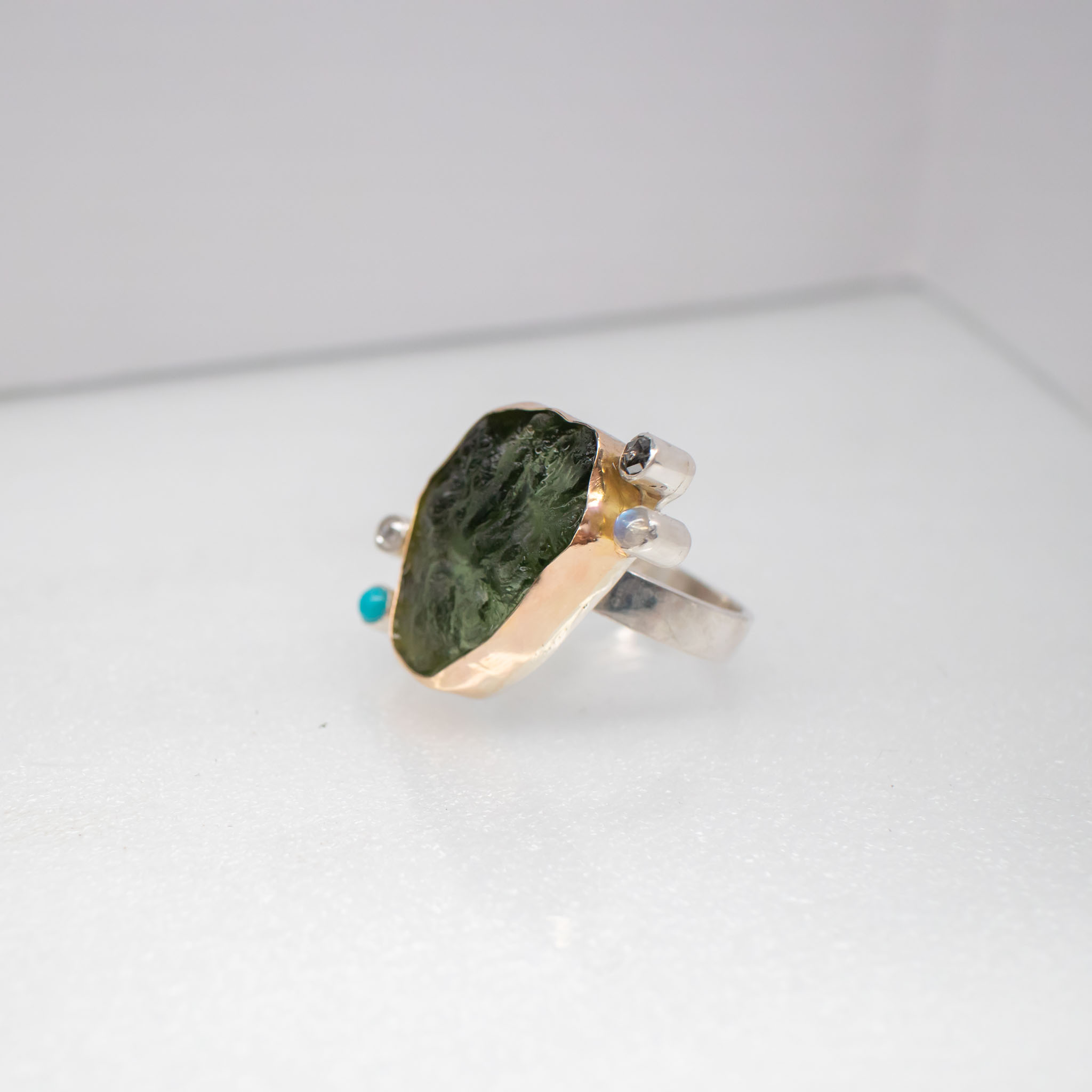 big moldavite ring with diamonds