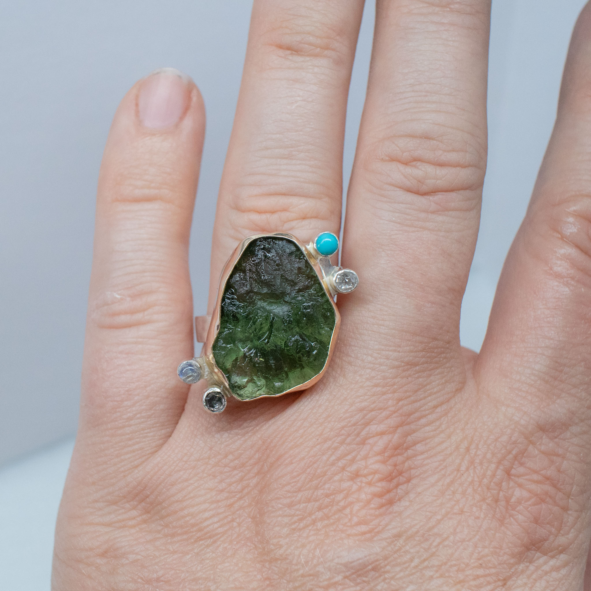 big moldavite ring with diamonds