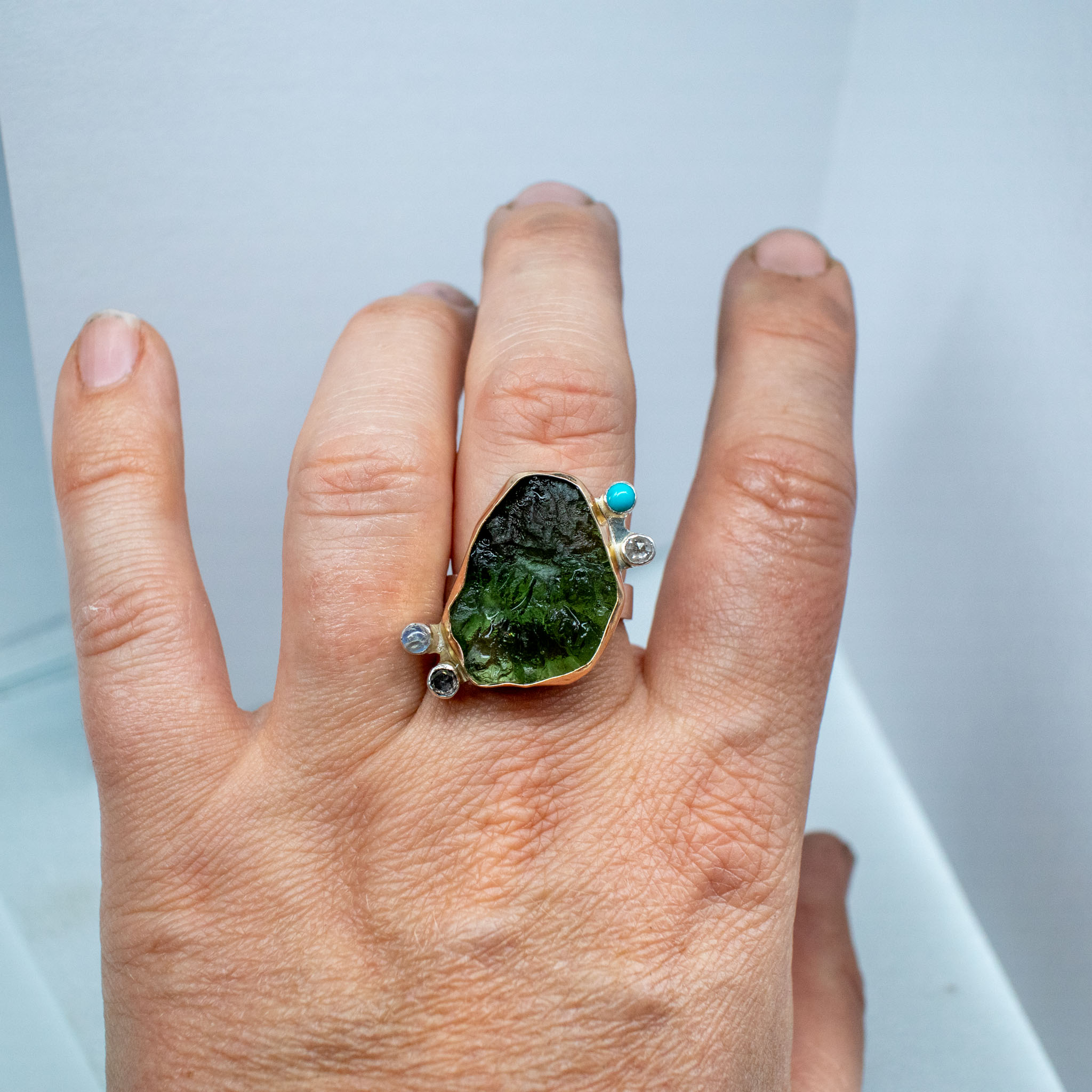 big moldavite ring with diamonds
